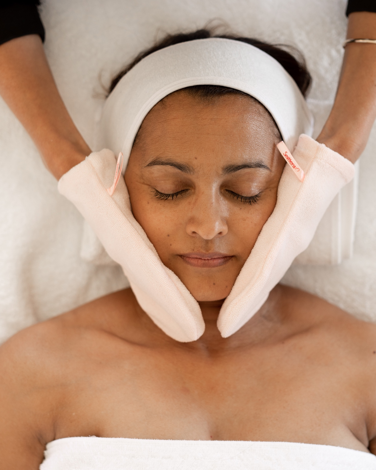 Smitten mitts used in a professional facial treatment
